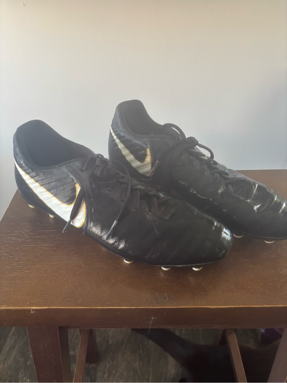 Nike Black Soccer Cleats with Gold Swoosh